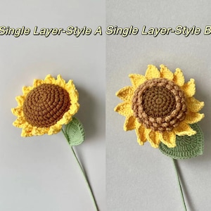 May include: Two crocheted sunflowers with green leaves. The sunflower on the left has a brown center and yellow petals. The sunflower on the right has a brown center and yellow petals. The text "Single Layer-Style A" is above the left sunflower and the text "Single Layer-Style B" is above the right sunflower.
