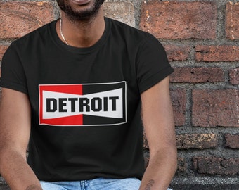 T-shirt Detroit, dans le style du logo Champion Spark Plug. Parfait pour les passionnés d'automobile ou les fans de motos !
