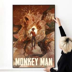 May include: A poster featuring a colourful illustration of a man standing on a white creature with a lion's head. The creature is surrounded by gold and brown swirls. The text "MONKEY MAN" is at the bottom of the poster.