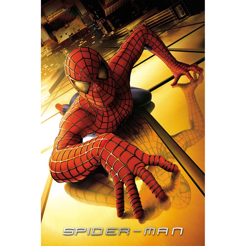 May include: A red and blue superhero, Spider-Man, is crawling on a yellow and gold surface. The image is a movie poster for the Spider-Man movie.