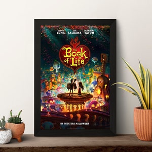 May include: A movie poster for the animated film "The Book of Life" featuring a red heart with the title in white text. The poster features a colorful illustration of a town with a couple standing on a platform. The poster includes the names of the actors Diego Luna, Zoe Saldana, and Channing Tatum.