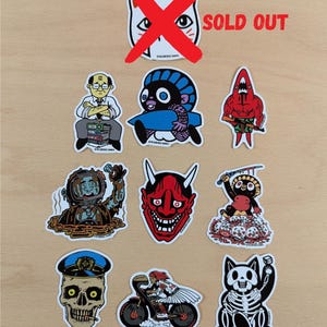 Set d'Autocollants Vinyle - Personnages Heldbergs | Stickers Créatifs pour Ordinateur Portable, Voiture, Carnet | 10 Designs Uniques