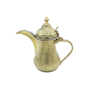 May include: A gold-colored metal teapot with a decorative lid and a handle. The teapot has a textured surface and a round body.