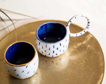 A set of cups for coffee or tea - completely handmade + gold. Beige clay, white glaze with blue pattern and gold details.
