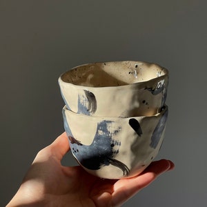 300 ml. Two ceramic cups without handle beige clay with matte and glossy glaze - with black dots - with black design - coffee cups