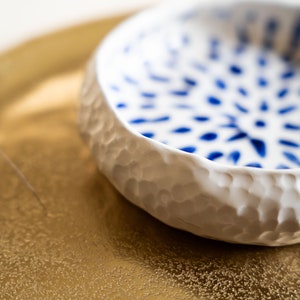 Ceramic bowl made of white clay with carving and painted with dark blue paint. image 10