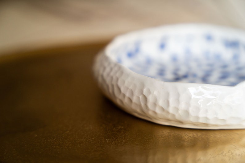 Ceramic bowl made of white clay with carving and painted with dark blue paint. image 8