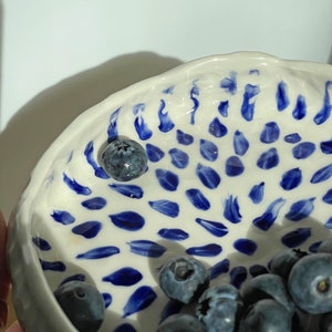 Ceramic bowl made of white clay with carving and painted with dark blue paint. image 6