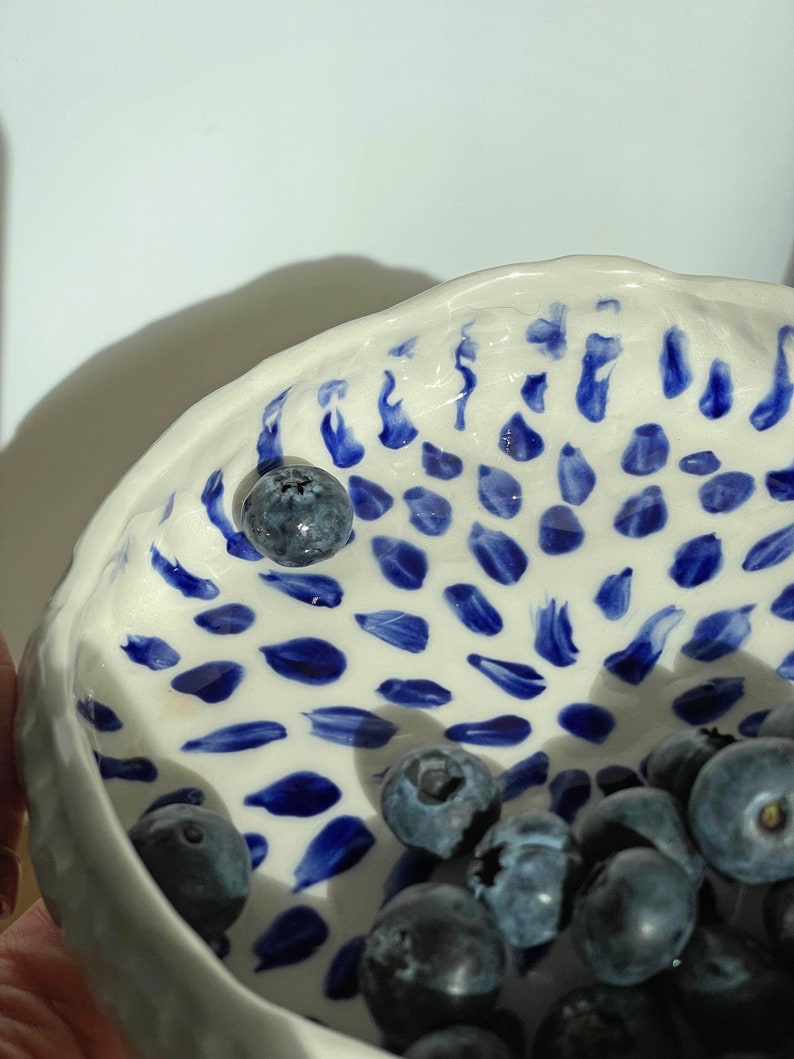 Ceramic bowl made of white clay with carving and painted with dark blue paint. image 6