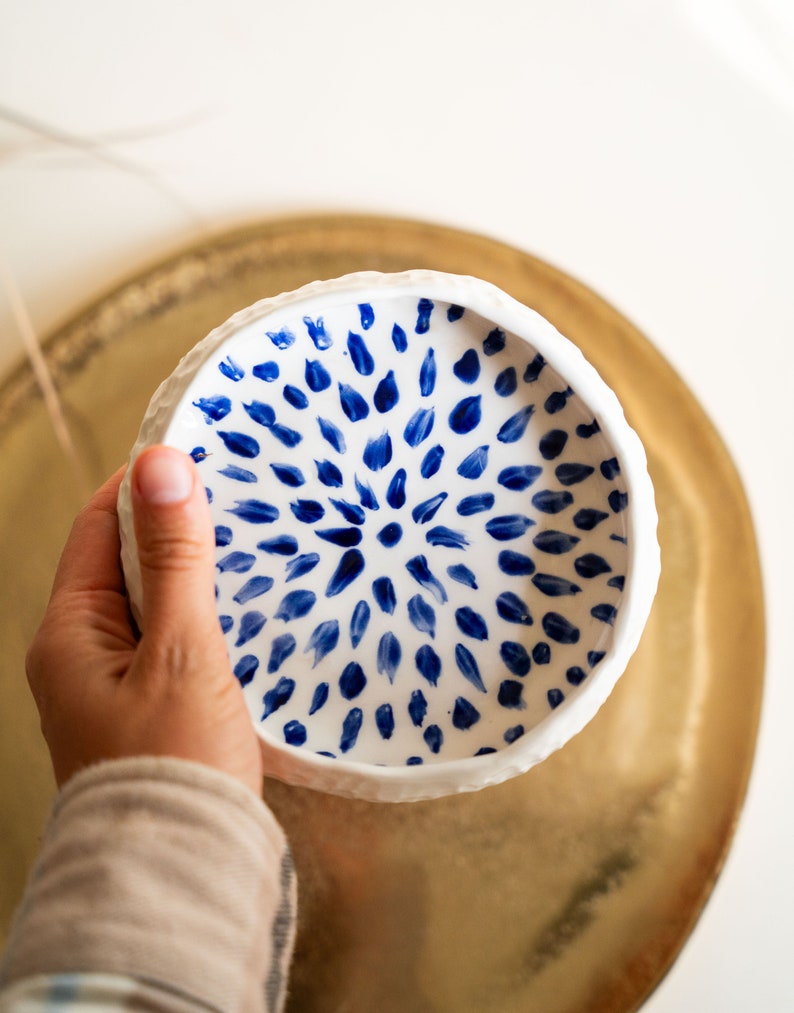 Ceramic bowl made of white clay with carving and painted with dark blue paint. image 9