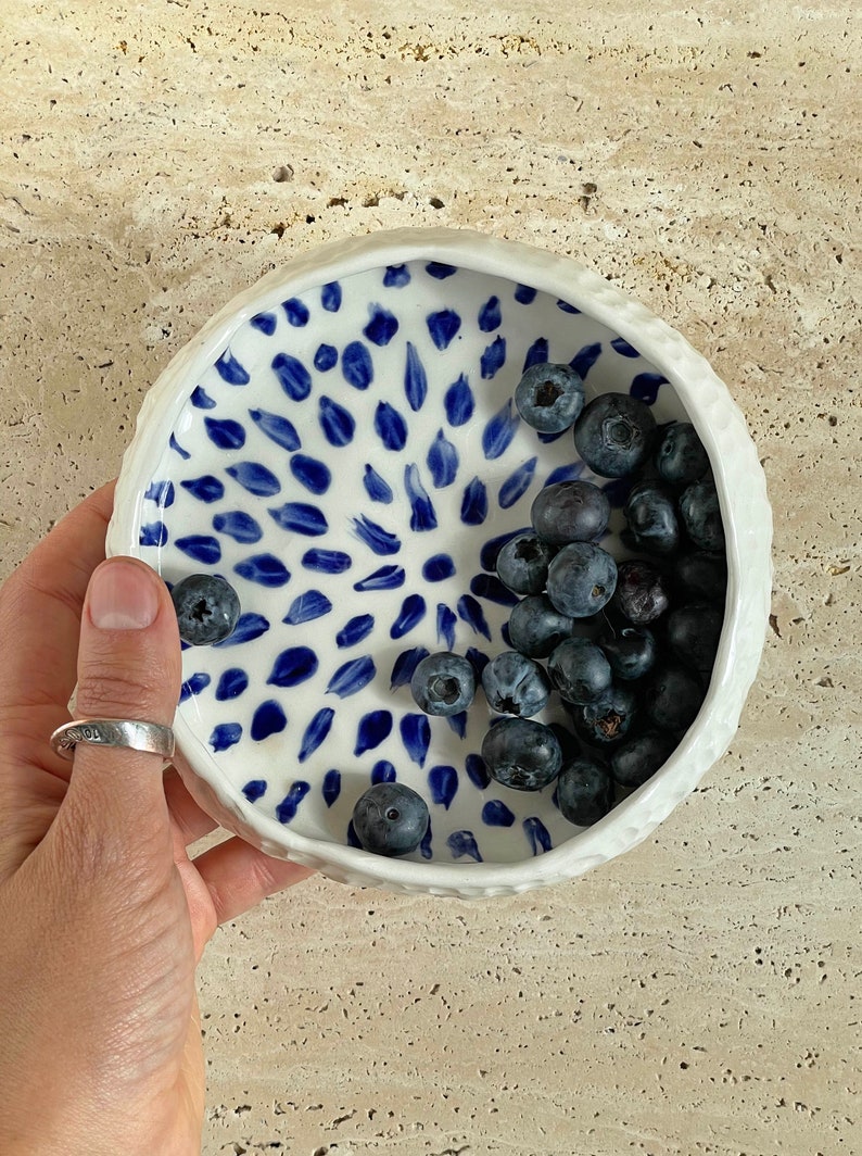 Ceramic bowl made of white clay with carving and painted with dark blue paint. image 7