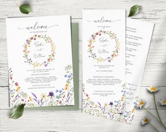 May include: Wedding invitation suite with a floral wreath design. The invitation features the names "Sophie and William" and the wedding date and location. The program includes the order of events for the ceremony and reception.