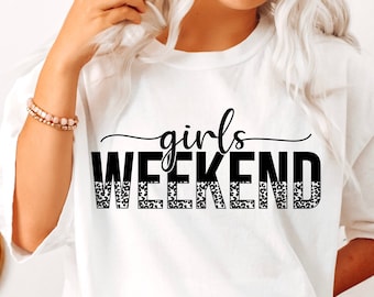 May include: White t-shirt with the text "girls weekend" in black with a leopard print design.