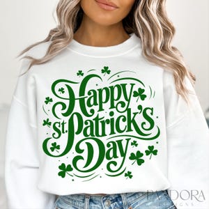 May include: White sweatshirt with green text that reads "Happy St. Patrick's Day" with shamrock designs.