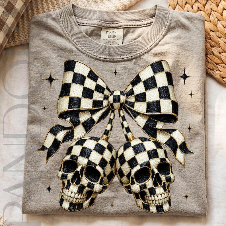 A gothic Halloween digital design featuring a large black and cream checkerboard bow with two matching skulls hanging underneath like charms. The skulls and ribbon share the same checkered pattern, outlined with metallic gold details. Small black stars surround the composition, creating a spooky coquette-style design with a bold black, cream, and gold color palette.