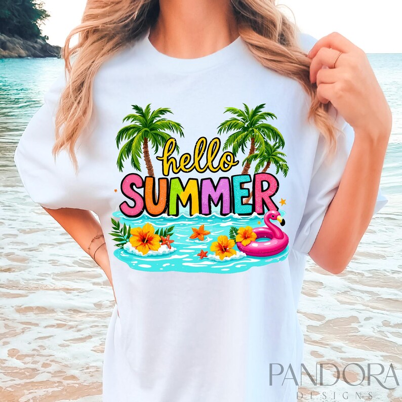 May include: White t-shirt with a colorful graphic design that says "hello summer". The design features palm trees, a pink flamingo float, and flowers.
