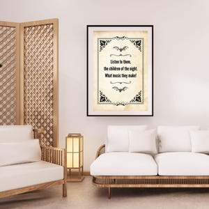 May include: A framed print with a black border, displaying the quote "Listen to them, the children of the night. What music they make!" in a decorative font. The print has bat and floral accents.