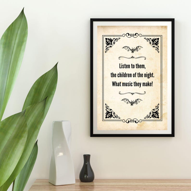May include: Black framed print with a vintage-style background and decorative corner elements. The text reads, "Listen to them, the children of the night. What music they make!" Two bat illustrations are also included.