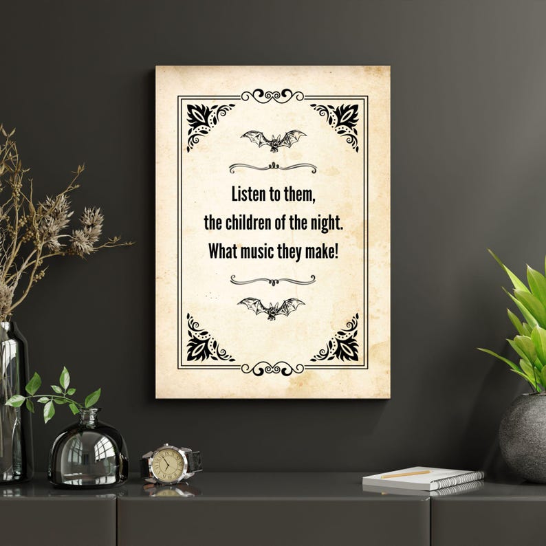 May include: A framed print with a vintage aesthetic. The text reads "Listen to them, the children of the night. What music they make!" in a serif font. The design includes bat illustrations and decorative corner elements.