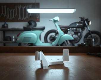 May include: A white plastic object sits on a wooden surface in a garage setting. A light blue scooter and a black motorcycle are in the background. Tools hang on the wall. The scene is lit by a fluorescent light.