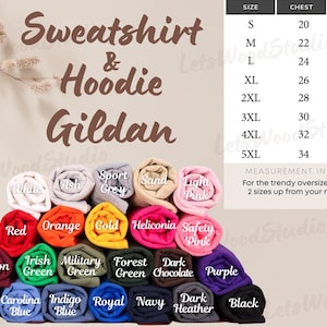 May include: A display of rolled Gildan sweatshirts and hoodies in various colors, including white, red, orange, and purple. A size chart shows chest and length measurements in inches, ranging from S to 5XL. The text "Sweatshirt & Hoodie Gildan" is at the top.