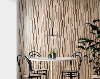 May include: A white round dining table with four black chairs. The chairs have a woven seat and a black metal frame. A black pendant light hangs above the table. The wall behind the table is covered in a wood paneling.