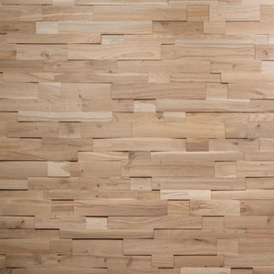 May include: A wall covered in a wood paneling made of various sized rectangular pieces of wood. The wood is a light brown color.