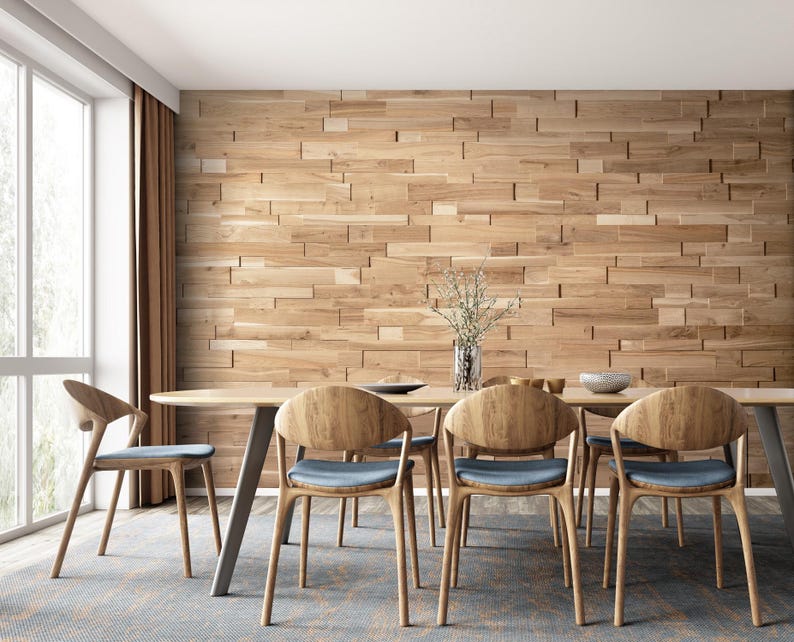May include: A modern dining room with a wooden table and chairs. The wall behind the table is covered in wood paneling. There is a vase of flowers on the table.