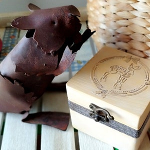wooden box with decoration of bambi in relief