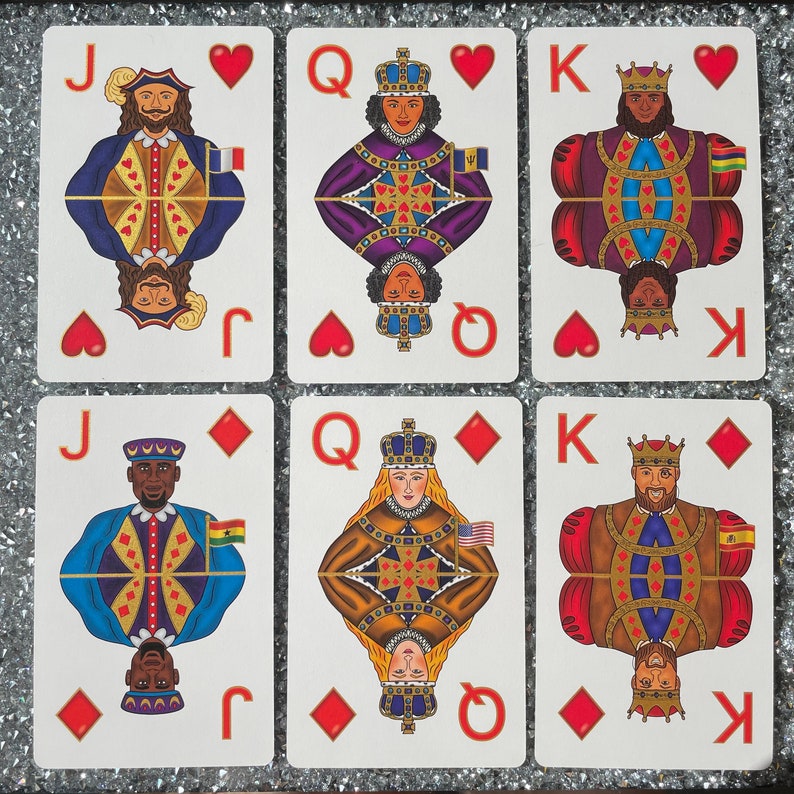 May include: A set of nine playing cards featuring a Jack, Queen, and King of hearts and diamonds. The cards are illustrated with people wearing crowns and traditional clothing. The suits are displayed in the top right corner of each card.