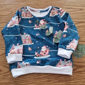 Handmade sweater in size 104, Santa Claus on a sleigh, blue/white, made of French terry, unisex sweater, cuffs in white
