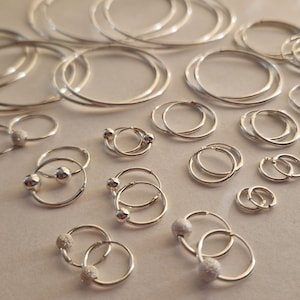 925 Sterling Silver Small Nose Hoop Ring with Fixed Gold Ball 925 Sterling Silver Small Nose Hoop Ring with Fixed Gold Ball