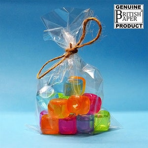 May include: A clear plastic bag tied with twine, filled with colourful, translucent ice cubes. The bag has a label that reads "GENUINE BRITISH PAPER PRODUCT".