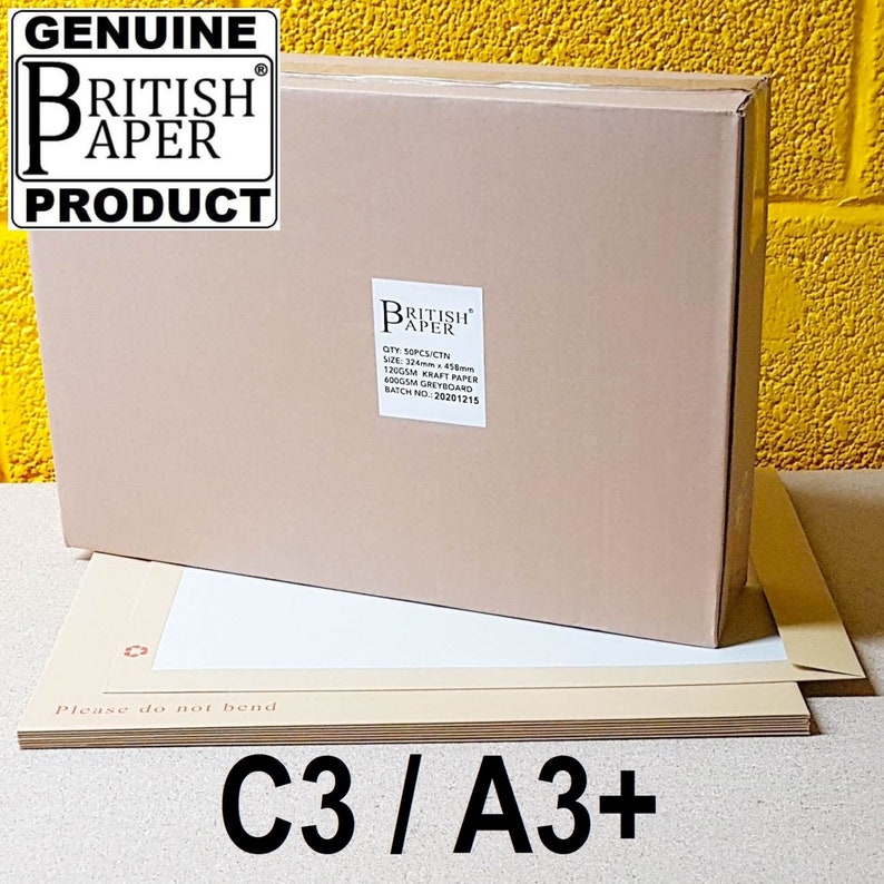 May include: A brown cardboard box with a white label that says "GENUINE BRITISH PAPER PRODUCT" and a smaller white label that says "BRITISH PAPER" with the text "QTY: 50PCS/CTN SIZE: 324mm x 458mm 120GSM KRAFT PAPER 600GSM GREYBOARD BATCH NO: 20201215". The box is sitting on top of a stack of brown paper sheets with the text "Please do not bend" and "C3/A3+" printed on them.