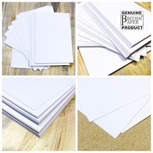 May include: A stack of white paper sheets, with a close-up of the edges showing the paper's thickness. The paper is labeled "Genuine British Paper Product".
