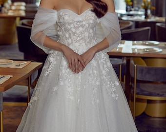 Enchanted Off-Shoulder Tulle Bridal Gown with Floral Embellishments and Sheer Overlay