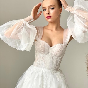 Tulle Wedding Dress - A Line Corset Bridal Gown with Sweetheart Neckline and Spaghetti Straps, Lace Details, and Open Back. Open shoulders
