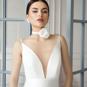 Elegant white Satin A-Line Bridal Gown with Plunging deep Neckline and Minimalist Bow Detail Timeless Wedding Dress Elegance with Straps image 2