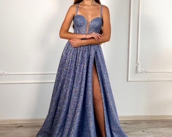 Long evening dress in sparkling blue with open shoulders and a corset. Cut on the leg.evening dress with a long skirt. Party Dress