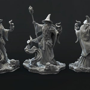 May include: A gray painted figurine of a wizard with a long beard and pointed hat, holding a staff with a glowing orb at the top. The wizard is standing on a base with flames and skulls.