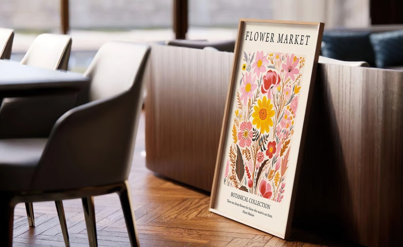 May include: A framed print with a floral design featuring pink, yellow, and red flowers. The print is titled "Flower Market" and includes the text "Botanical Collection".