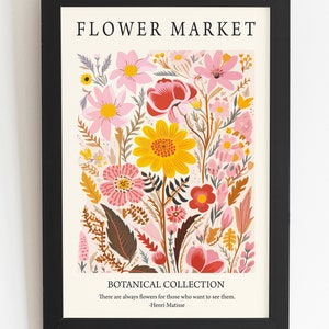 May include: A framed print with a floral design featuring pink, red, yellow, and orange flowers. The print has the text "FLOWER MARKET" and "BOTANICAL COLLECTION" with a quote by Henri Matisse: "There are always flowers for those who want to see them."