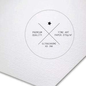 May include: A white circle with a black star in the center and a black cross with the text "Premium Quality", "Fine Art Paper 270g/m&sup2;", and "Ultrachrome HD Ink" on it.
