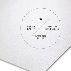 May include: A white circle with a black star in the center and a black cross with the text "Premium Quality", "Fine Art Paper 270g/m&sup2;", and "Ultrachrome HD Ink" on it.