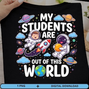 May include: A black t-shirt featuring a colorful space-themed graphic with two astronauts, a rocket ship, planets, stars, and clouds. The text reads MY STUDENTS ARE OUT OF THIS WORLD, with the letter O in WORLD replaced by an illustration of Earth.