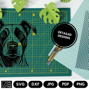 May include: Black and white line art illustration of a dog's head. The image is on a green cutting mat with a ruler and a craft knife. The text "DETAILED DESIGNS" is on a black circle.