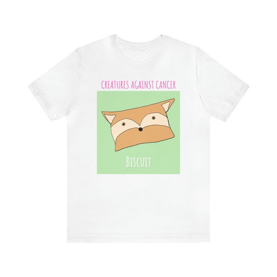 Creatures Against Cancer graphic T-shirt

Design Details:
This is Biscuit the fox. Biscuit loves baking all sorts of pies, cupcakes, and cookies. He also likes running around the forest. Singing to music on the radio is one of his favorite things to do. This furry fox will always try to cheer someone up by giving them a big hug. Whenever you are feeling down, just give Biscuit a big squeeze! 

Our Mission:
To bring happiness, peace and comfort to cancer patients and survivors. All proceeds go to benefit people living with cancer. We are a 501(c)(3) non-profit, EIN: 81-2224679.

T-Shirt Details:
This classic unisex jersey short sleeve tee fits like a well-loved favorite. These t-shirts have-ribbed knit collars to bolster shaping. The shoulders have taping for better fit over time. Dual side seams hold the garment&#39;s shape for longer. 
.: 100% Airlume combed and ringspun cotton (fiber content may vary for different colors)
.: Light fabric (4.2 oz/yd² (142 g/m²))
.: Retail fit
.: Tear away label
.: Runs true to size