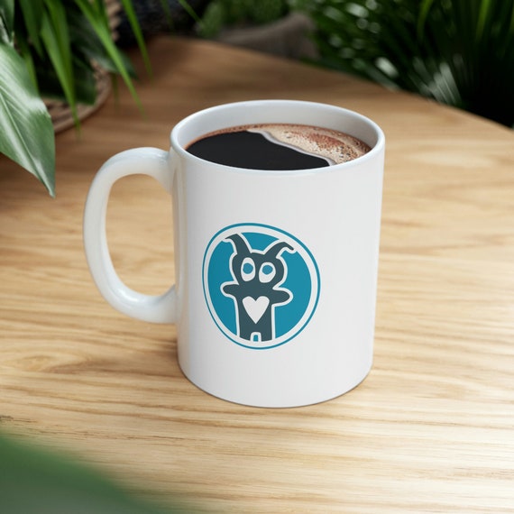 Warm-up with a nice cuppa out of this Creature logo ceramic coffee mug. It’s BPA and Lead-free, microwave & dishwasher-safe, and made of white, durable ceramic in 11-ounce size. A perfect gift for coffee, tea, and chocolate lovers.
.: White ceramic
.: 11 oz (0.33 l)
.: Rounded corners
.: C-handle
.: Lead and BPA-free