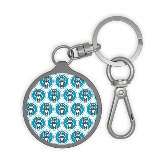 CAC Creature pattern keyring. Made with high-quality hardware fittings, a TPU cover, and a robust acrylic plate, this keyring is as durable as it is stylish. Attach this CAC key ring to any keyset like a charm or onto a bag as a tag to help your items stand out in the crowd. Let everyone know you support cancer patients where ever you are.

.: Material: acrylic plate with TPU cover
.: Quality hardware fitting
.: Round shape
.: Key ring included
