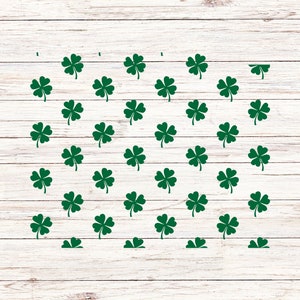 May include: A white wood background with a pattern of green four-leaf clovers.